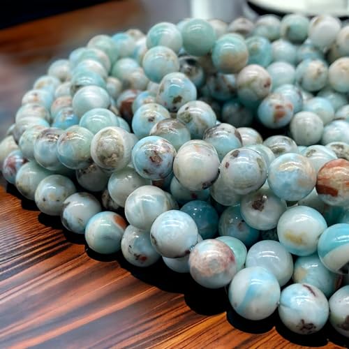 Larimar-Perlen in der Dominikanischen Republik mit schwarzem Eisenoxid-Einschluss (diese Häma-Einschlüsse manifestieren sich als schwarze Streifen und bieten einen auffälligen Kontrast Larimar-Perlen in der Dominikanischen Republik mit schwarzem Eisenoxid-Einschluss (diese Häma-Einschlüsse manifestieren sich als schwarze Streifen und bieten einen auffälligen Kontrast von ASKFNASDKMFN