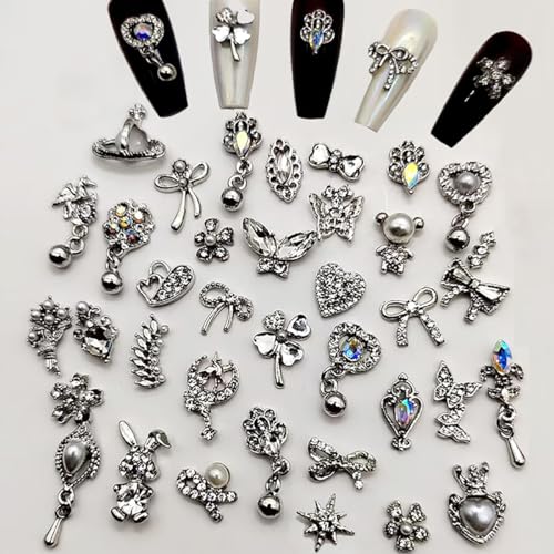 Silber Nail Charms,50 Stück Memischte 3D Perlen Strasssteine Schmetterling Schleifen Luxus Metal Nagelkunst Charms,Legierung Nagelsteine Nägel Zubehör für Mädchen DIY Maniküre Design(C Muster Silber) Silber Nail Charms,50 Stück Memischte 3D Perlen Strasssteine Schmetterling Schleifen Luxus Metal Nagelkunst Charms,Legierung Nagelsteine Nägel Zubehör für Mädchen DIY Maniküre Design(C Muster Silber) von OTKARXUS