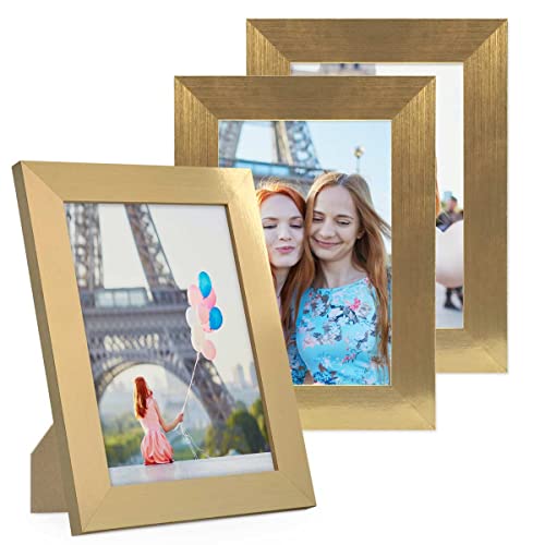 PHOTOLINI Bilderrahmen 10x15 cm Gold MDF-Holz, breite Rahmen, 3er Set, modern, bruchsicheres Acrylglas, zum Aufhängen & Aufstellen, extra Zubehör - für Ihre stilvolle Wanddekoration PHOTOLINI Bilderrahmen 10x15 cm Gold MDF-Holz, breite Rahmen, 3er Set, modern, bruchsicheres Acrylglas, zum Aufhängen & Aufstellen, extra Zubehör - für Ihre stilvolle Wanddekoration von PHOTOLINI