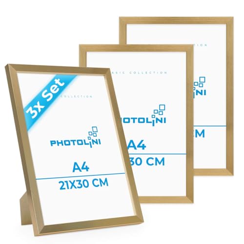 PHOTOLINI Bilderrahmen A4 Holz MDF Gold, 3er Set DIN A4 Bilderrahmen 21x30 gold, Rahmen 21x30 mit Acrylglas, picture frame zum Aufhängen & Aufstellen, Rahmen 30x21 mit Zubehör für Fotos & Poster PHOTOLINI Bilderrahmen A4 Holz MDF Gold, 3er Set DIN A4 Bilderrahmen 21x30 gold, Rahmen 21x30 mit Acrylglas, picture frame zum Aufhängen & Aufstellen, Rahmen 30x21 mit Zubehör für Fotos & Poster von PHOTOLINI