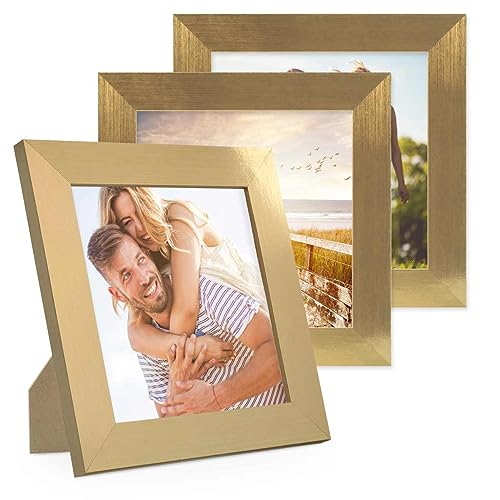 PHOTOLINI Bilderrahmen 15x15 cm Gold MDF-Holz, breite Rahmen, 3er Set, modern, bruchsicheres Acrylglas, zum Aufhängen & Aufstellen, extra Zubehör - für Ihre stilvolle Wanddekoration PHOTOLINI Bilderrahmen 15x15 cm Gold MDF-Holz, breite Rahmen, 3er Set, modern, bruchsicheres Acrylglas, zum Aufhängen & Aufstellen, extra Zubehör - für Ihre stilvolle Wanddekoration von PHOTOLINI