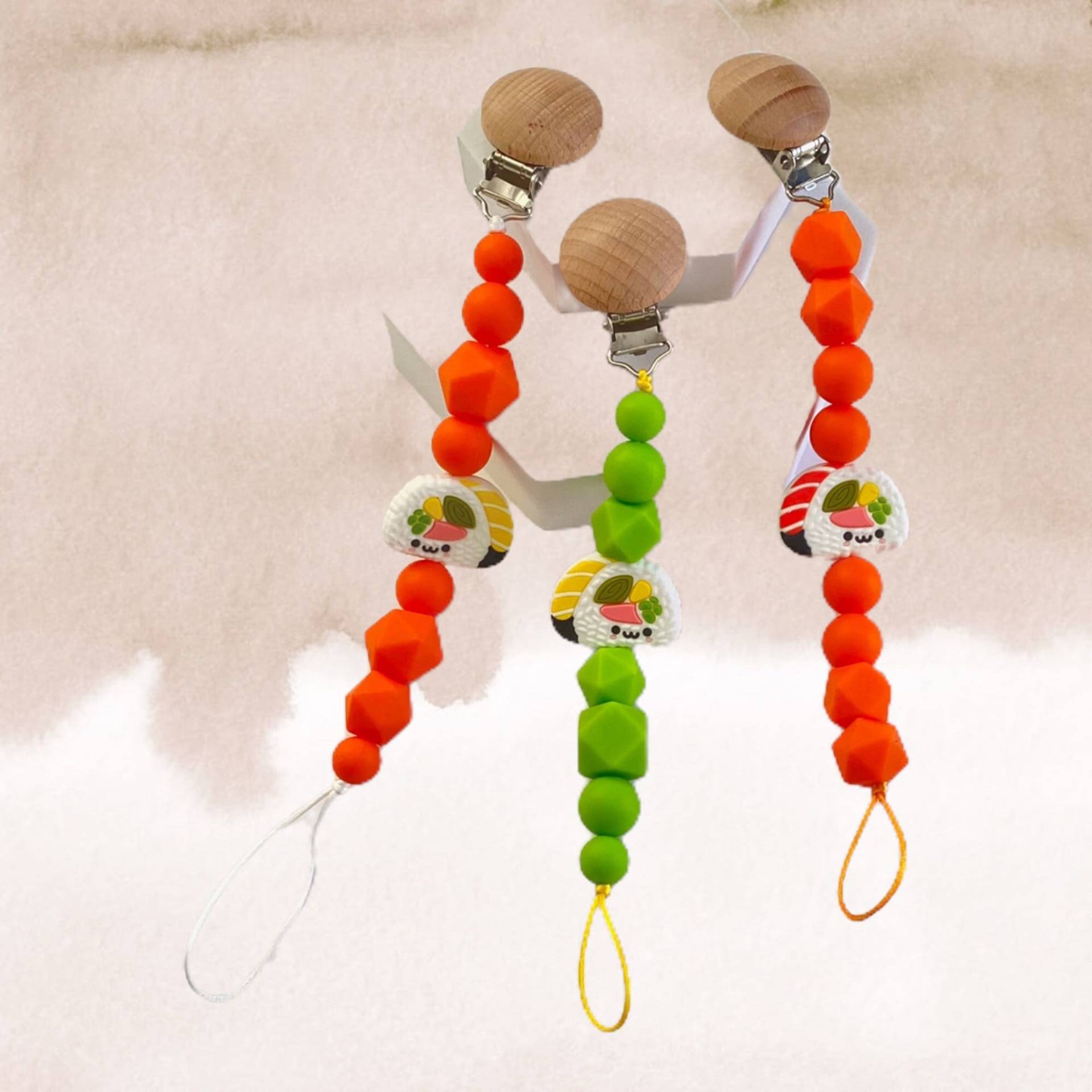 Silikon Sushi Schnullerclip Orange Lindgrün| Schnullerhalter Lindgrün Silikon Sushi Schnullerclip Orange Lindgrün| Schnullerhalter Lindgrün von PacificPacifiers